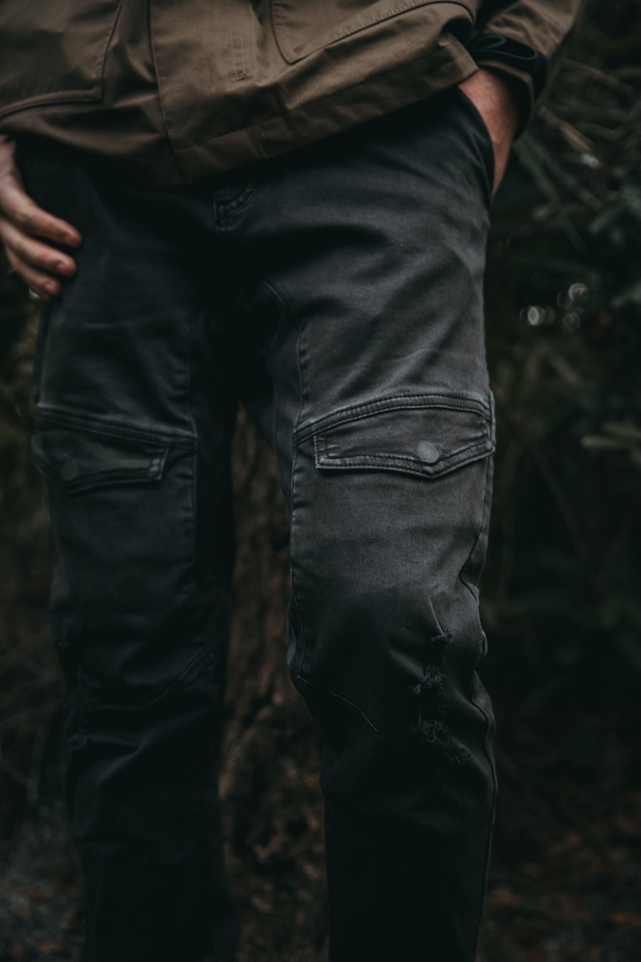 Black cargo trousers worn outdoors with pocket detail visible