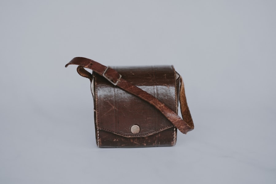 Brown leather crossbody bag photo checked for material closeup